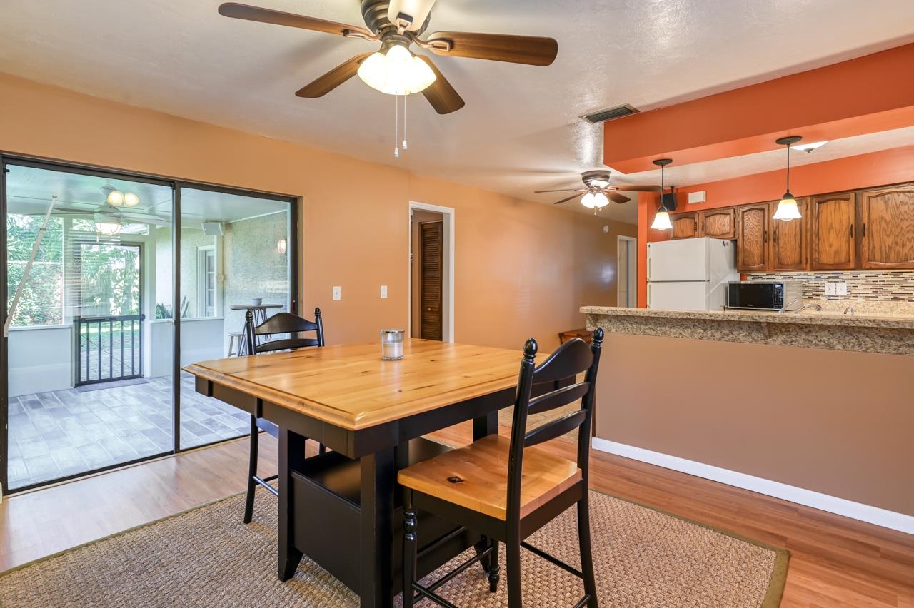 336 Lobelia Road St. Augustine, FL 32086 - Photo 14 of 46 a room with stainless steel appliances kitchen island a table and chairs in it
