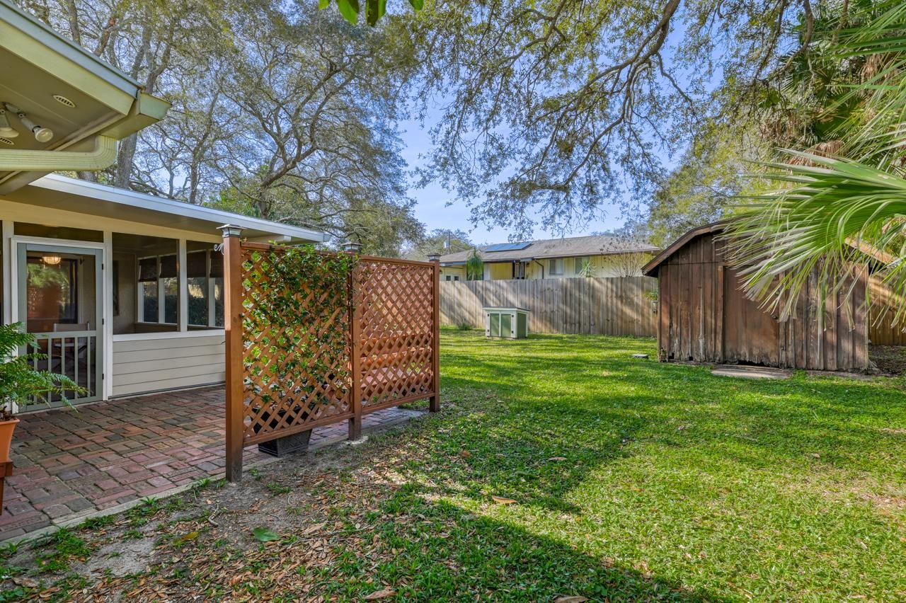 336 Lobelia Road St. Augustine, FL 32086 - Photo 19 of 46 a view of a house with a yard and tree