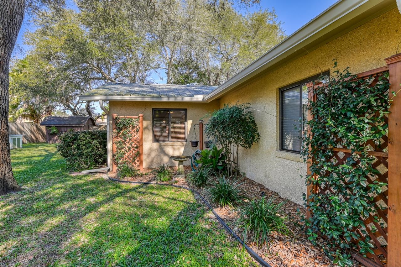 336 Lobelia Road St. Augustine, FL 32086 - Photo 25 of 46 a front view of a house with garden