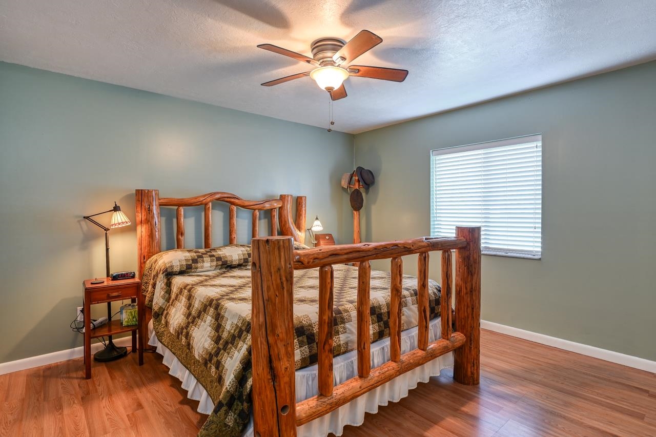 336 Lobelia Road St. Augustine, FL 32086 - Photo 26 of 46 a bedroom with furniture and wooden floor