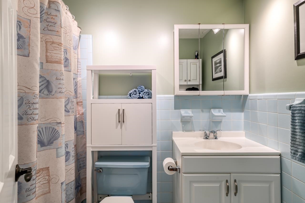 336 Lobelia Road St. Augustine, FL 32086 - Photo 29 of 46 a bathroom with a sink and a mirror