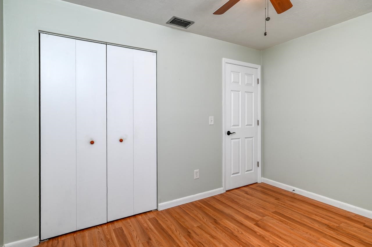 336 Lobelia Road St. Augustine, FL 32086 - Photo 31 of 46 a view of a room with wooden floor and closet
