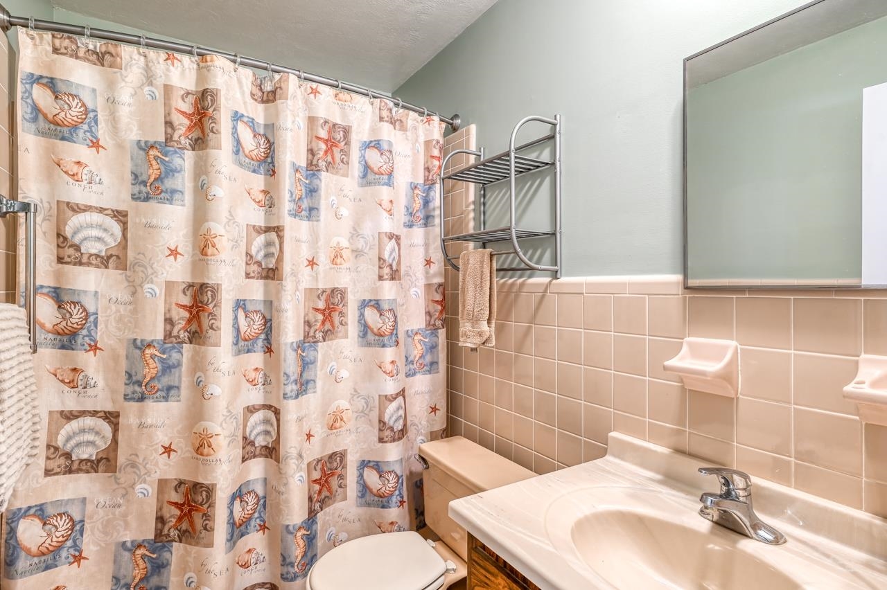 336 Lobelia Road St. Augustine, FL 32086 - Photo 32 of 46 a bathroom with a sink toilet and shower
