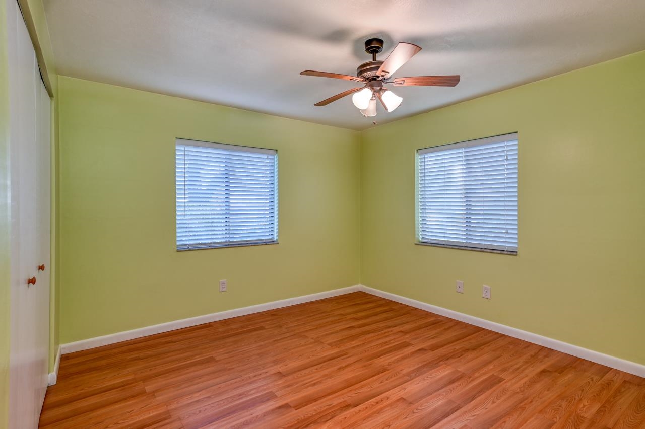336 Lobelia Road St. Augustine, FL 32086 - Photo 33 of 46 a view of an empty room with wooden floor and a window