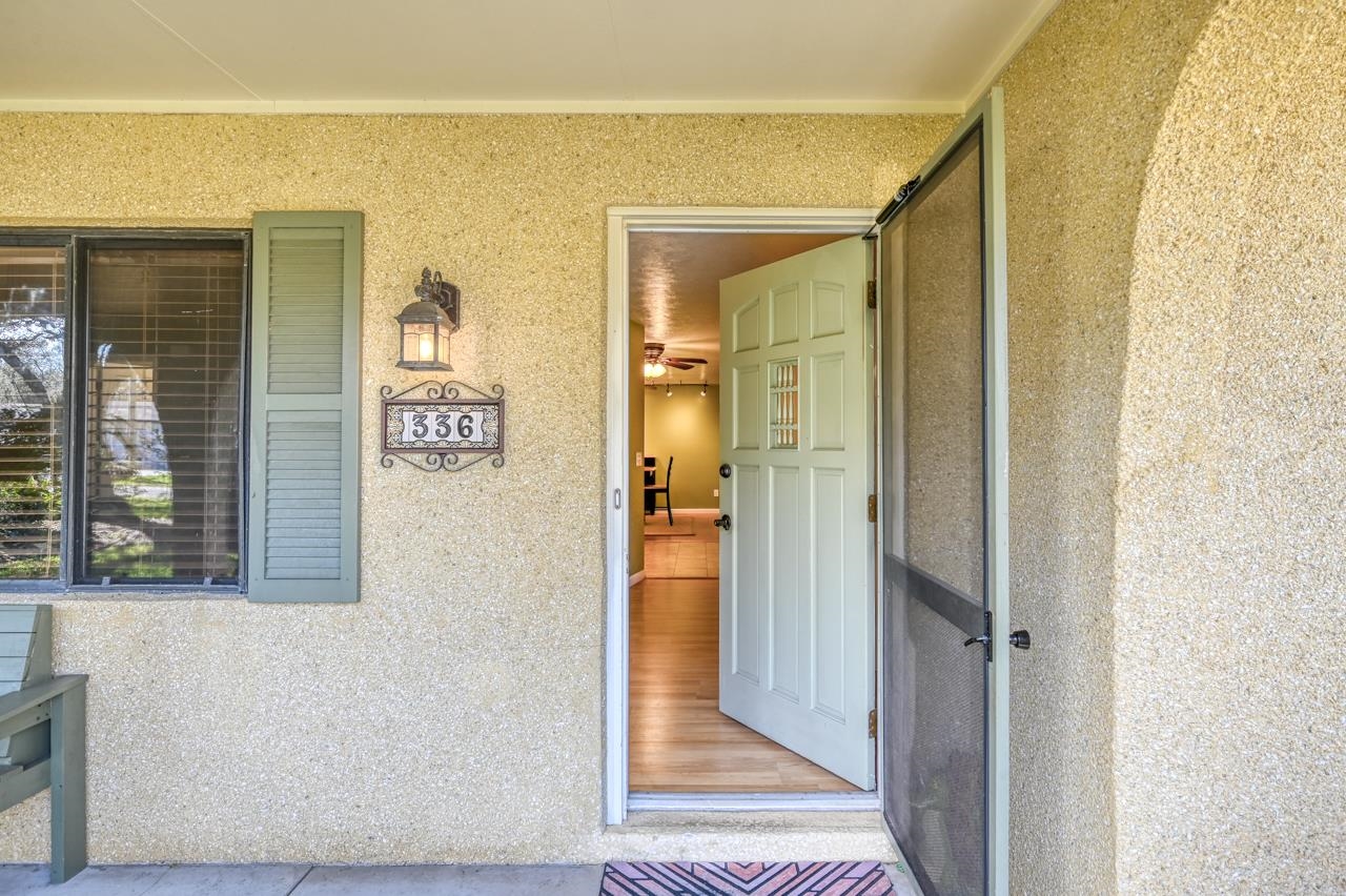 336 Lobelia Road St. Augustine, FL 32086 - Photo 5 of 46 a view of a hallway with wooden floor and a living room