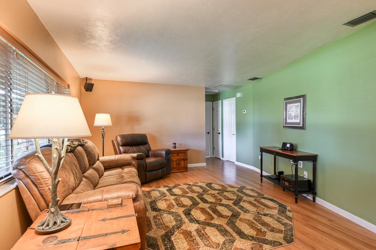 336 Lobelia Road St. Augustine, FL 32086 - Photo 6 of 46 a living room with furniture and wooden floor