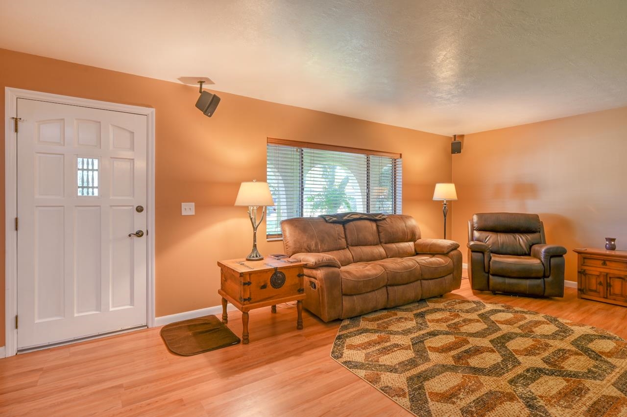 336 Lobelia Road St. Augustine, FL 32086 - Photo 7 of 46 a living room with furniture and a wooden floor