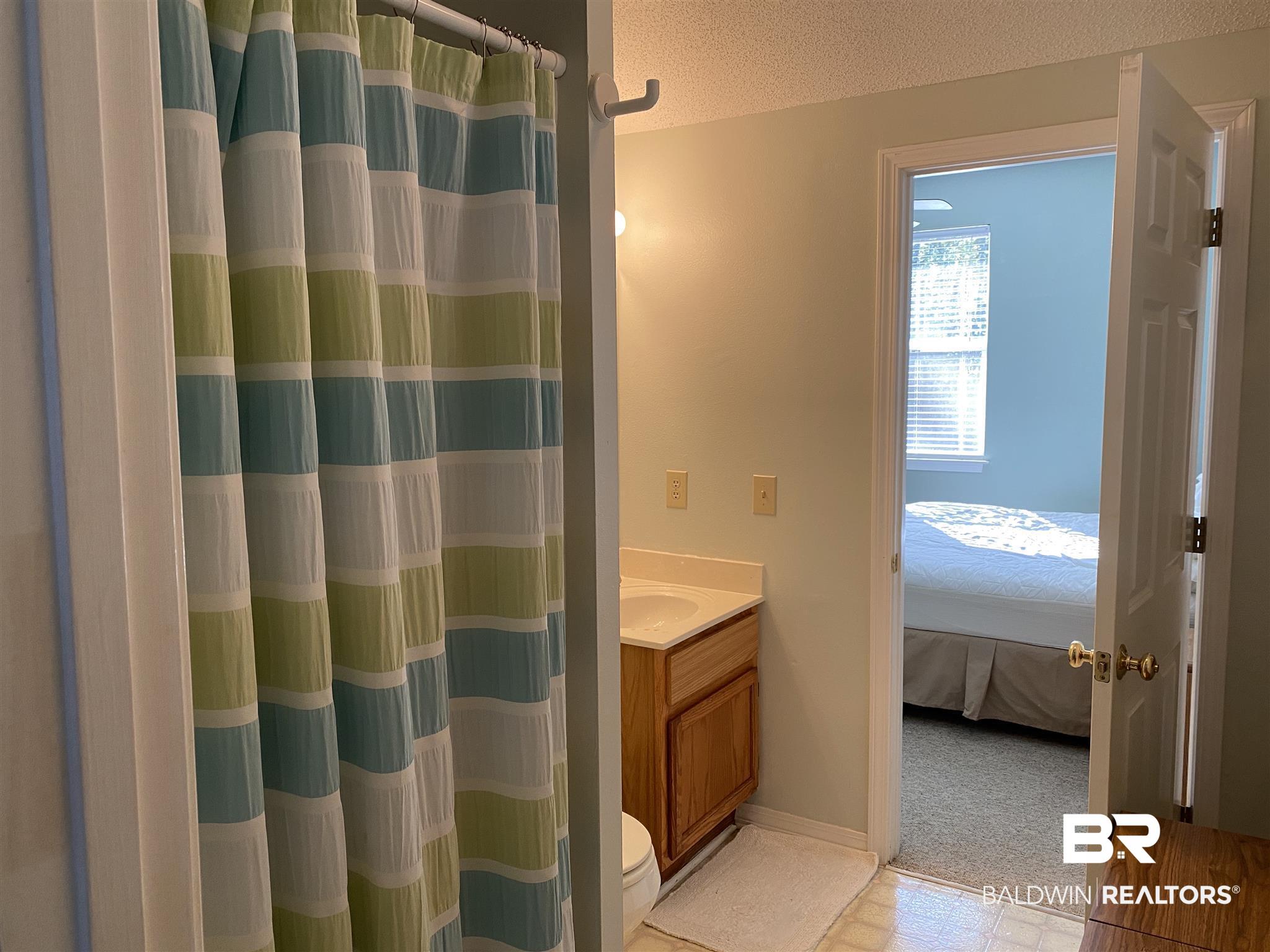 18765 Pine Acres Road Gulf Shores, AL 36542 - Photo 23 of 47 Jack and Jill bathroom between Bd 2 and Master