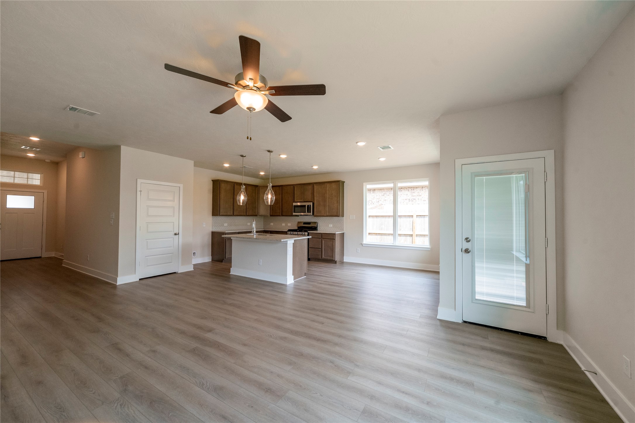 2051 Winepress Road Brenham, TX 77833 - Photo 19 of 31 a view of kitchen with microwave and window