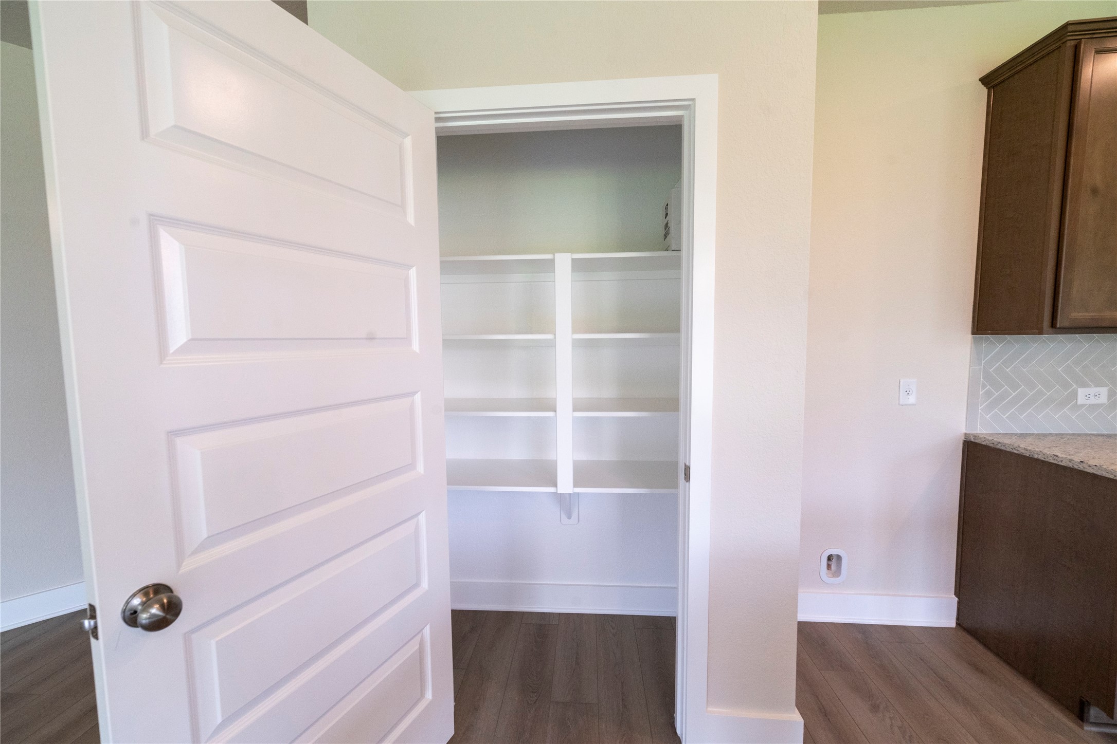 2051 Winepress Road Brenham, TX 77833 - Photo 22 of 31 a view of walk in closet with empty racks