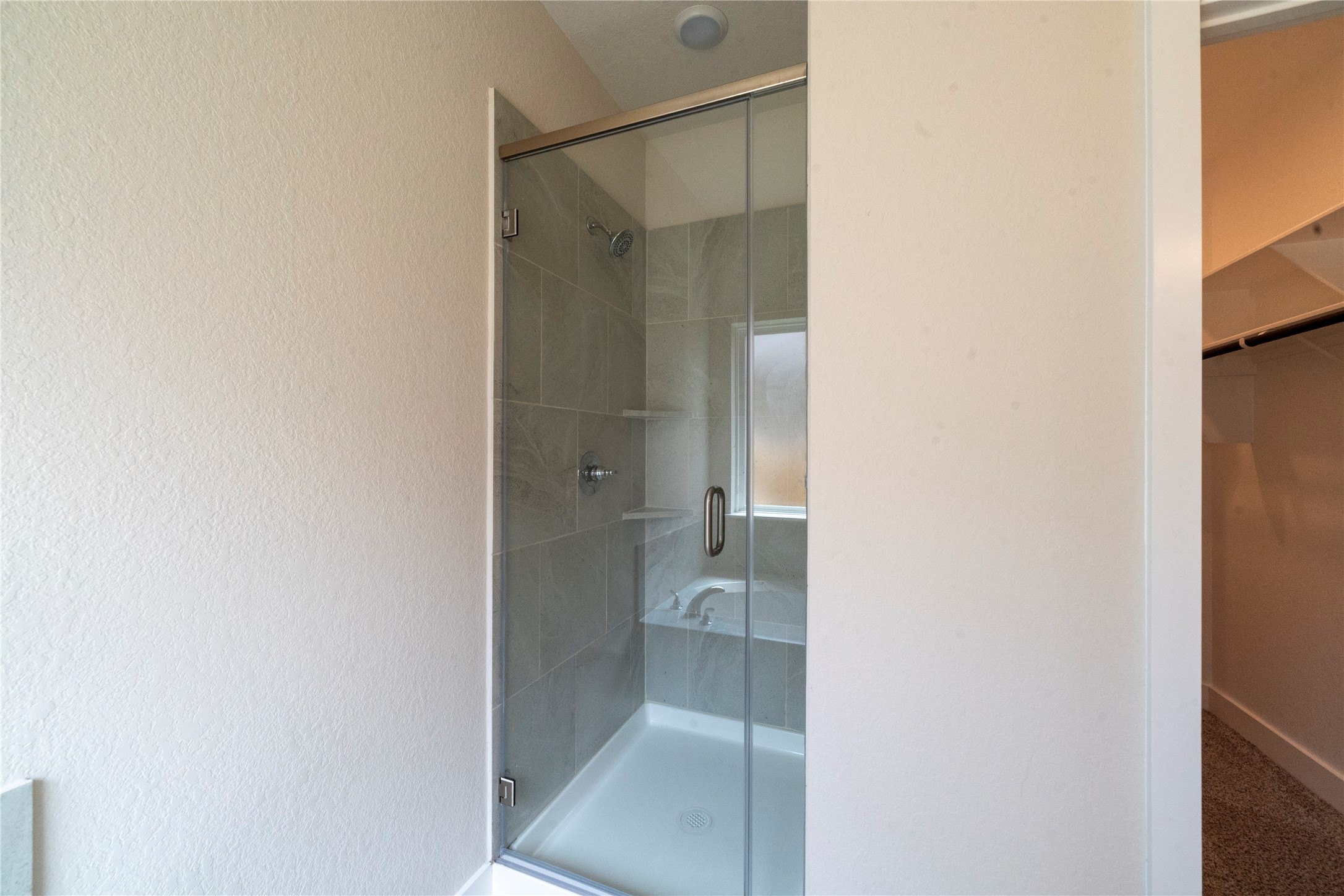 2051 Winepress Road Brenham, TX 77833 - Photo 28 of 31 a bathroom with a glass shower door