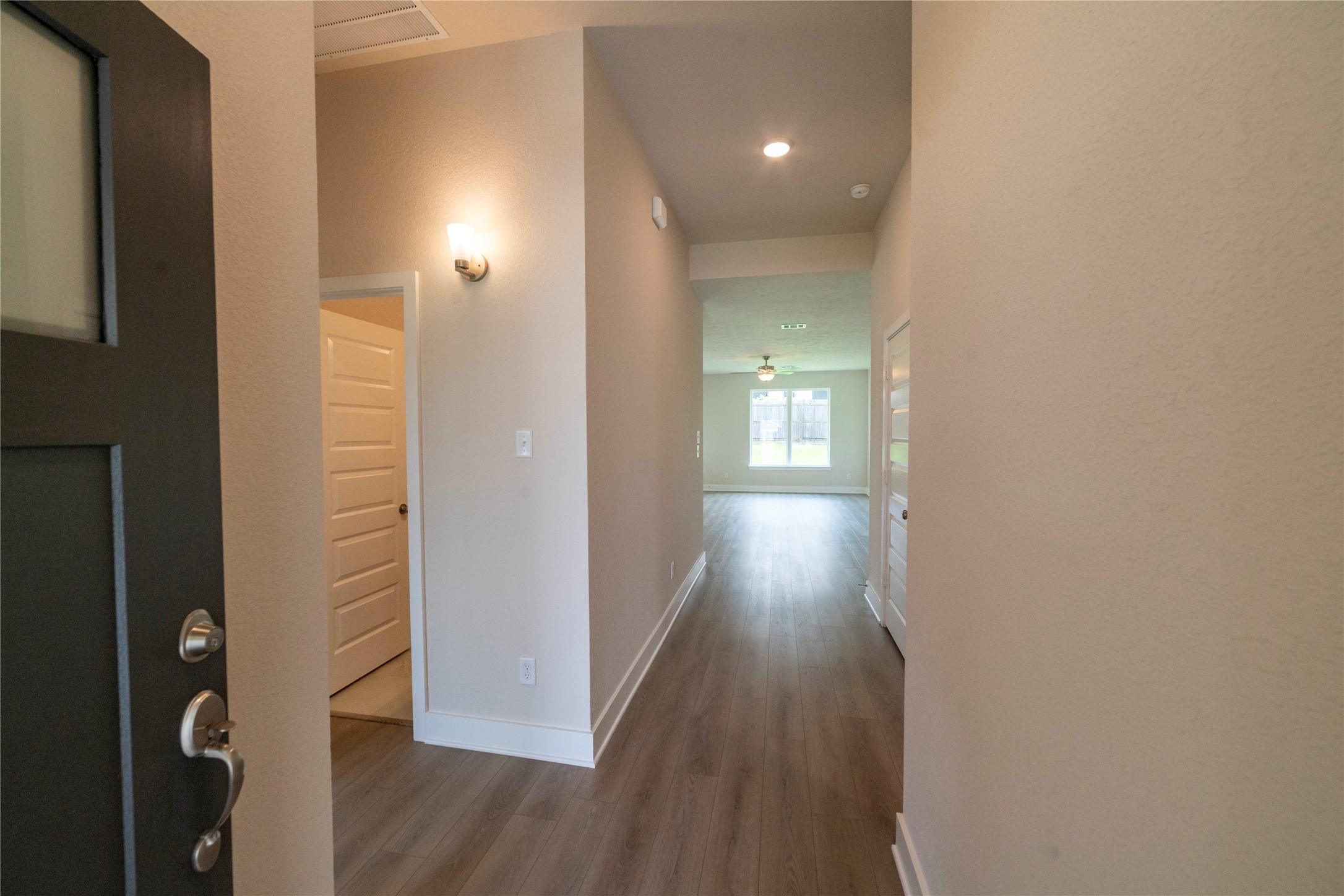 2051 Winepress Road Brenham, TX 77833 - Photo 4 of 31 a view of hallway with wooden floor