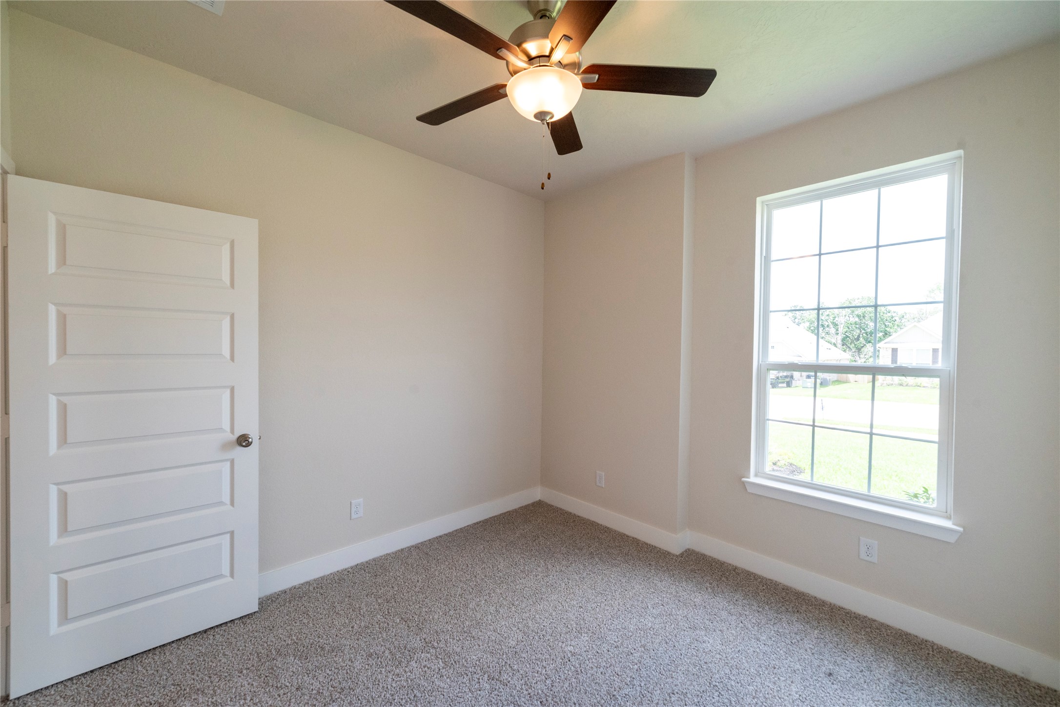 2051 Winepress Road Brenham, TX 77833 - Photo 7 of 31 an empty room with closet and window