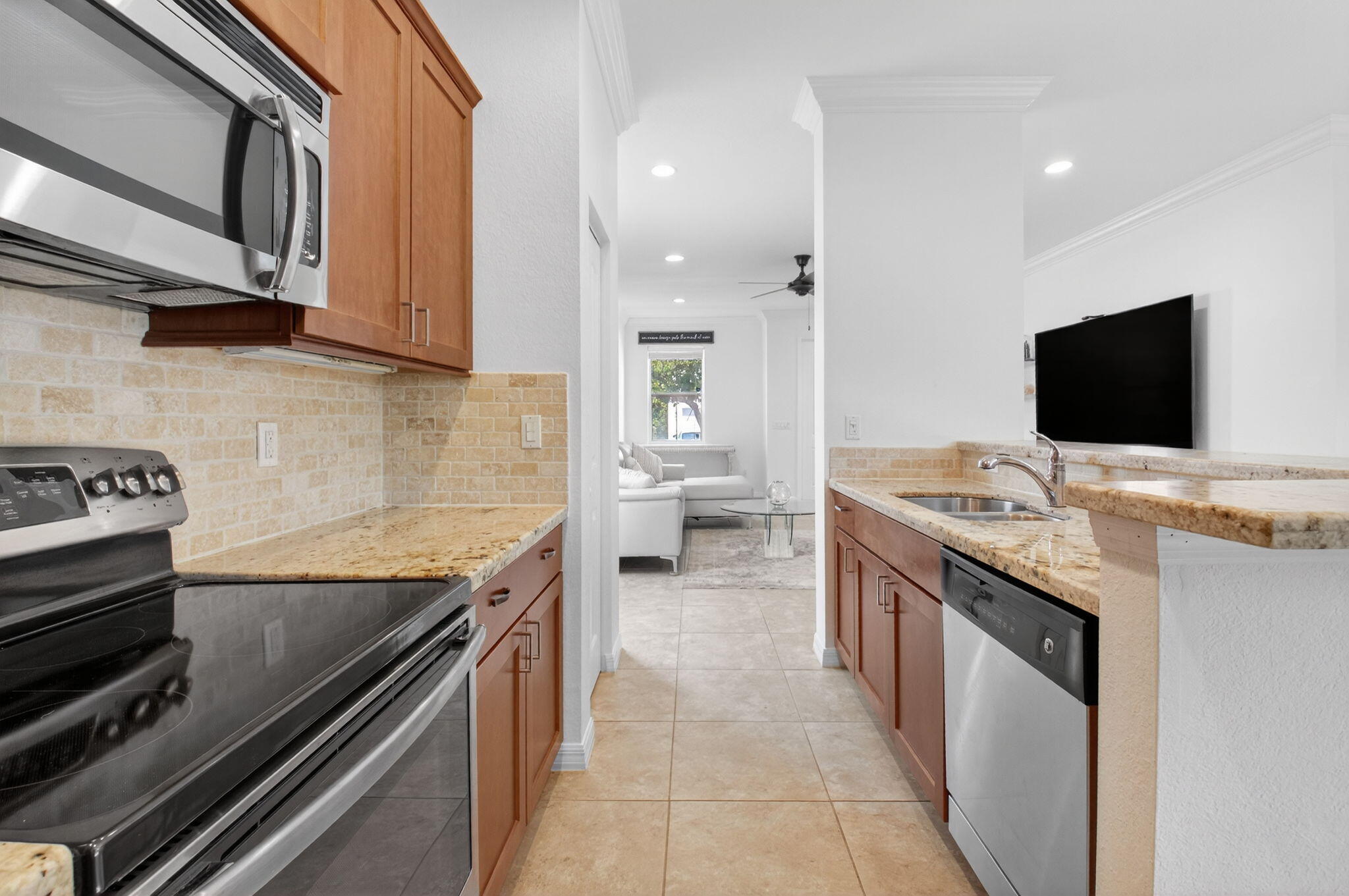 3630 Wolf Run Lane Boynton Beach, FL 33435 - Photo 13 of 59 a kitchen with a stove and a sink