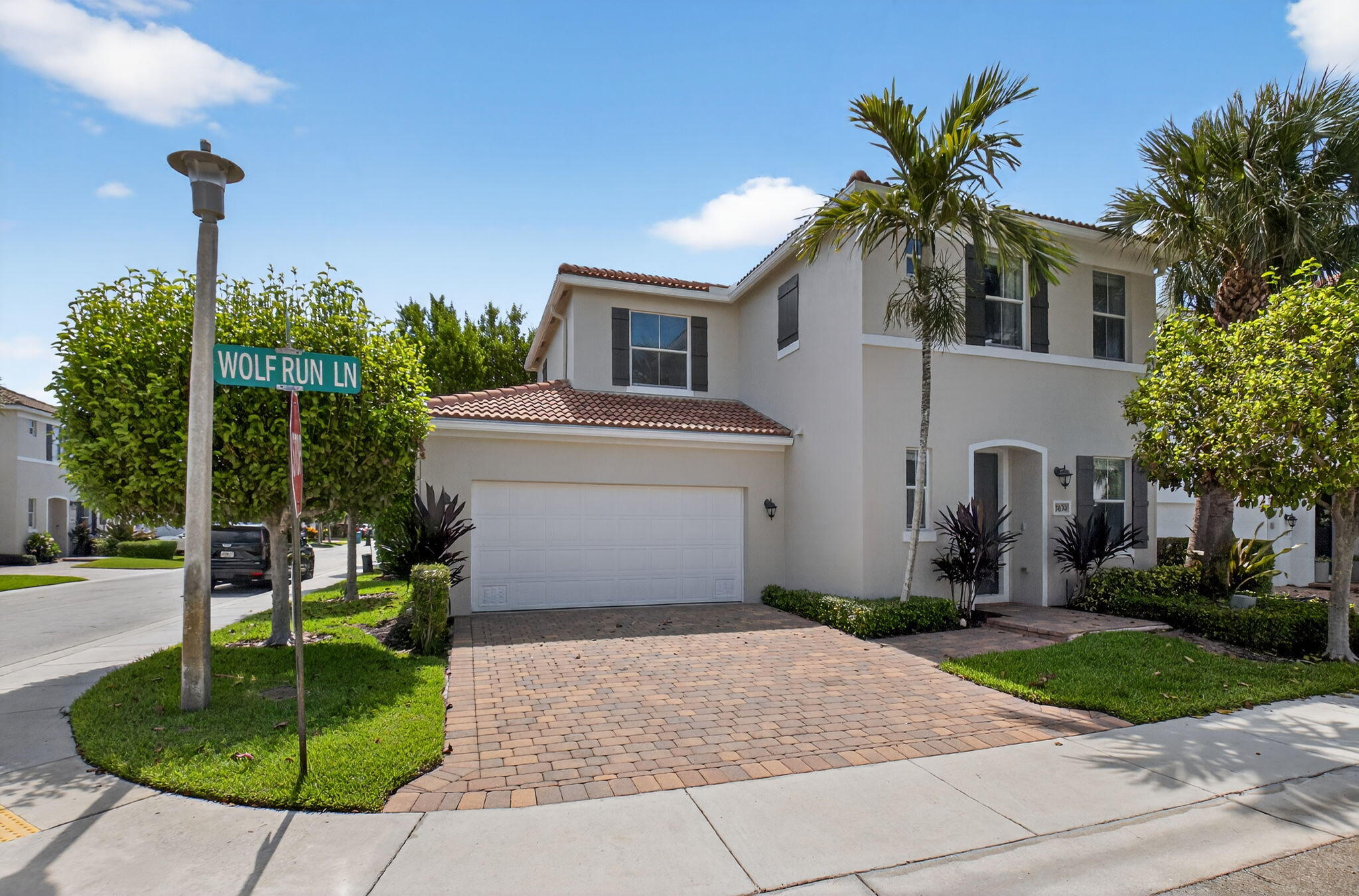 3630 Wolf Run Lane Boynton Beach, FL 33435 - Photo 2 of 59 a house view with a garden space