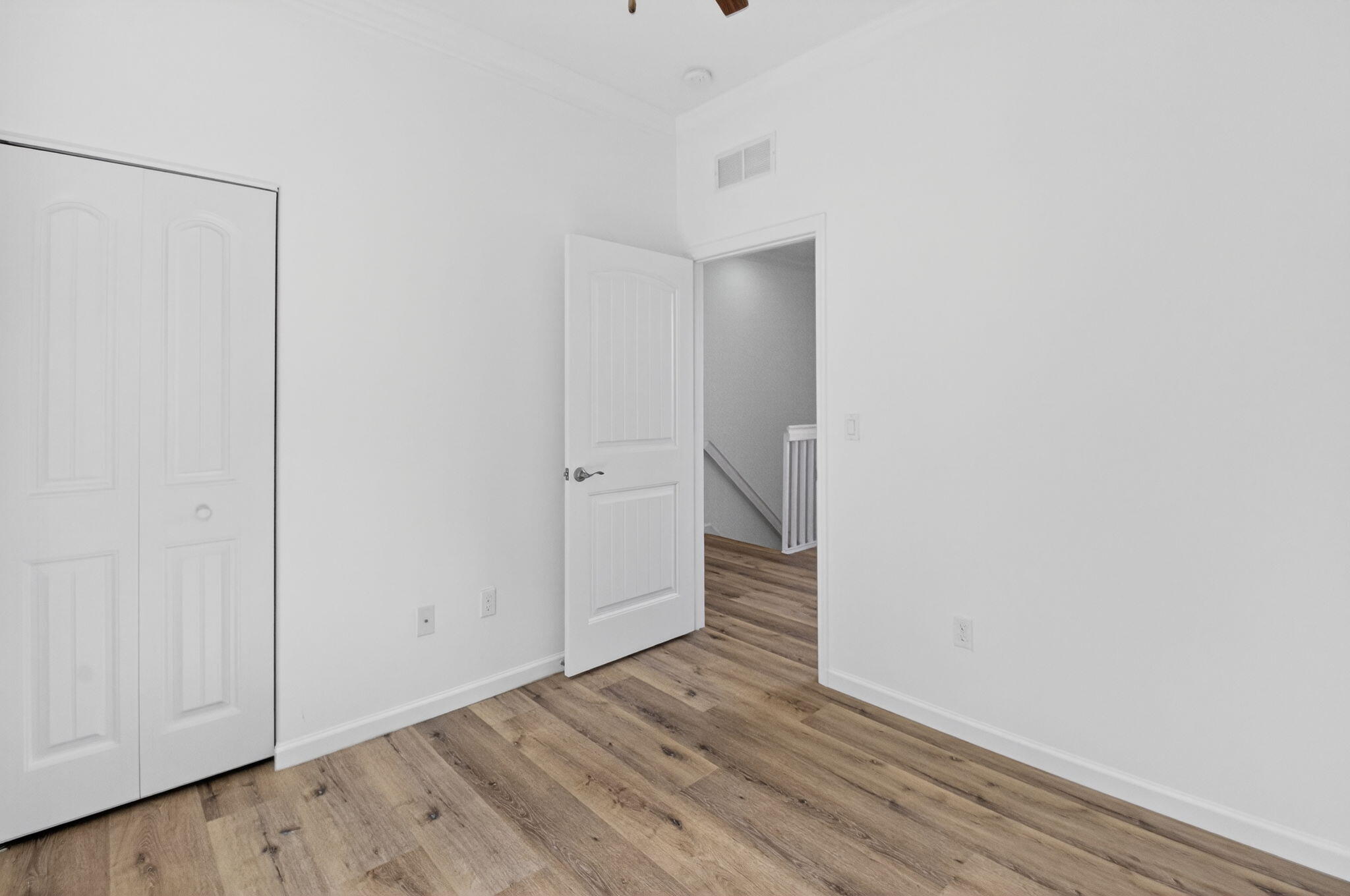 3630 Wolf Run Lane Boynton Beach, FL 33435 - Photo 22 of 59 a view of an empty room with wooden floor