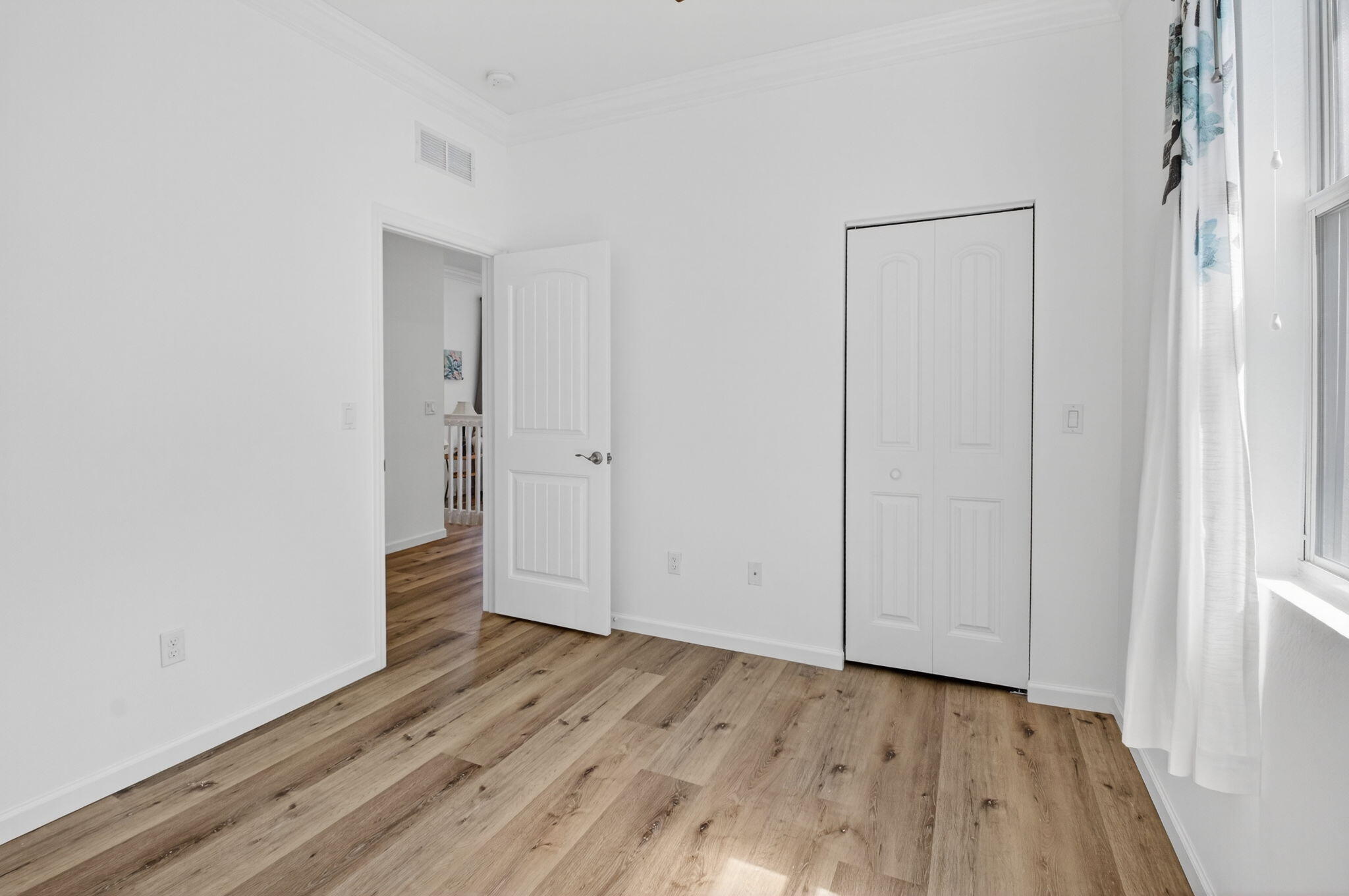 3630 Wolf Run Lane Boynton Beach, FL 33435 - Photo 26 of 59 a view of an empty room with wooden floor