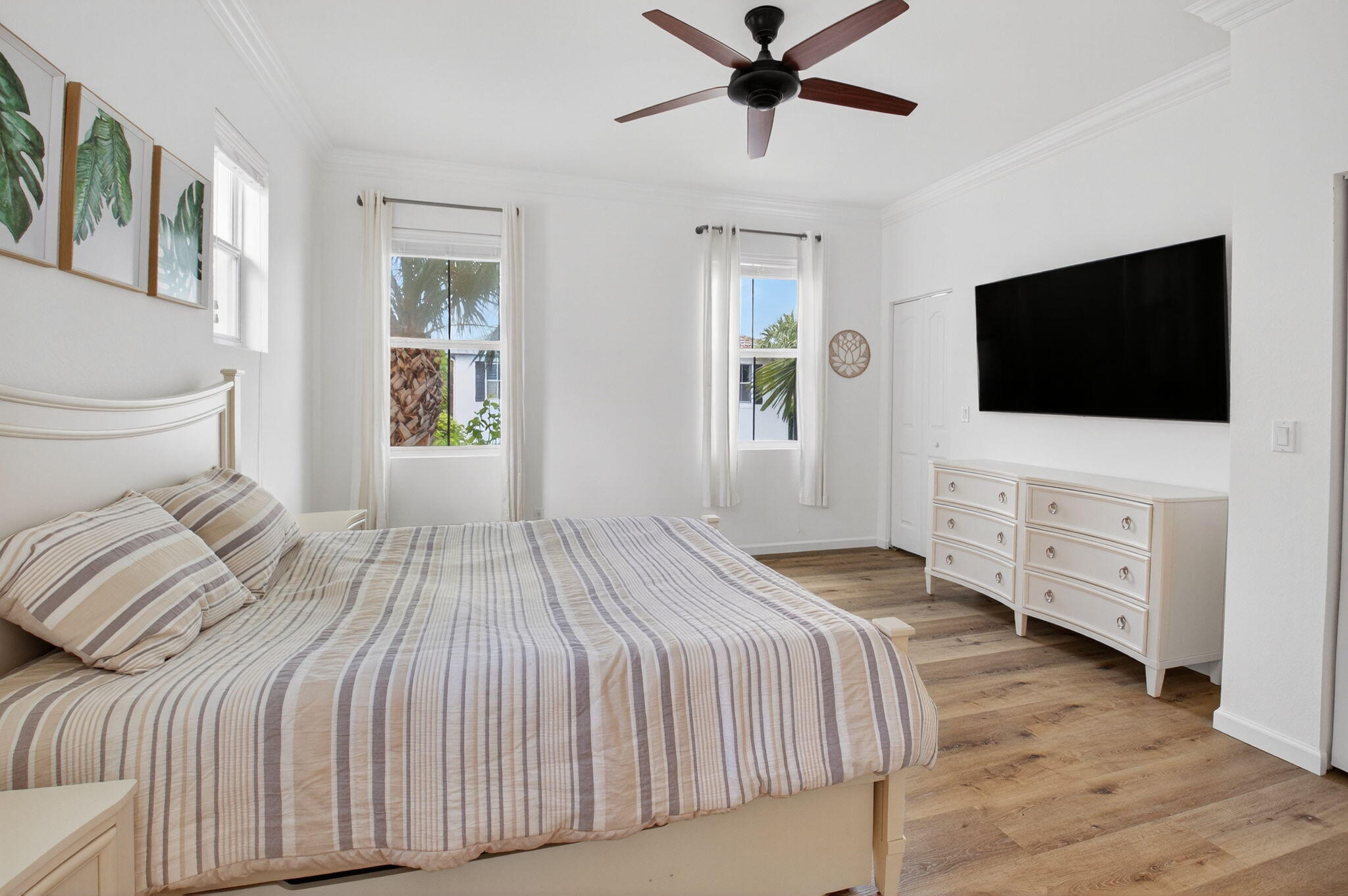 3630 Wolf Run Lane Boynton Beach, FL 33435 - Photo 30 of 59 a bedroom with a bed tv and a window