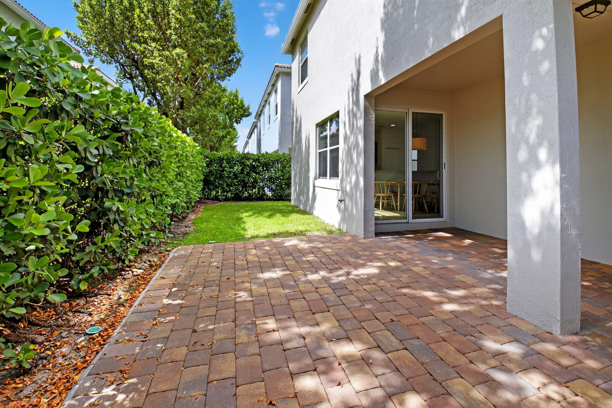3630 Wolf Run Lane Boynton Beach, FL 33435 - Photo 39 of 59 a view of a pathway with a house in the background