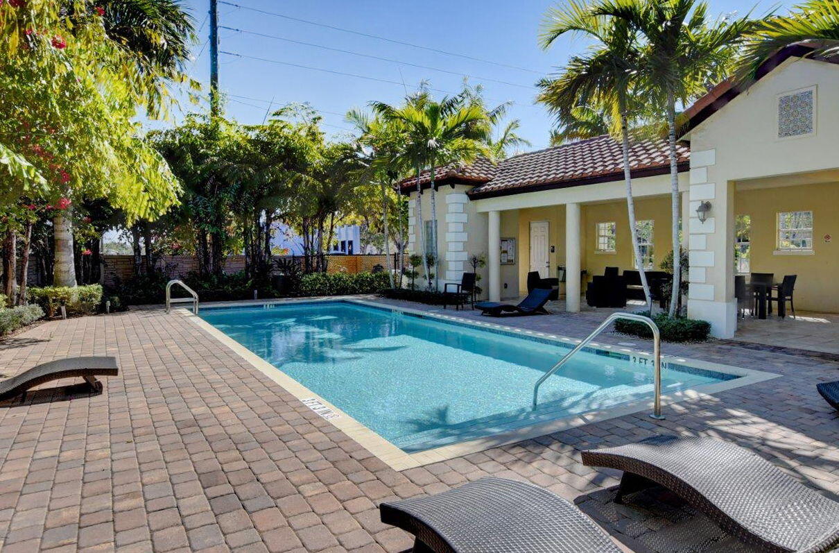 3630 Wolf Run Lane Boynton Beach, FL 33435 - Photo 42 of 59 a view of a house with swimming pool