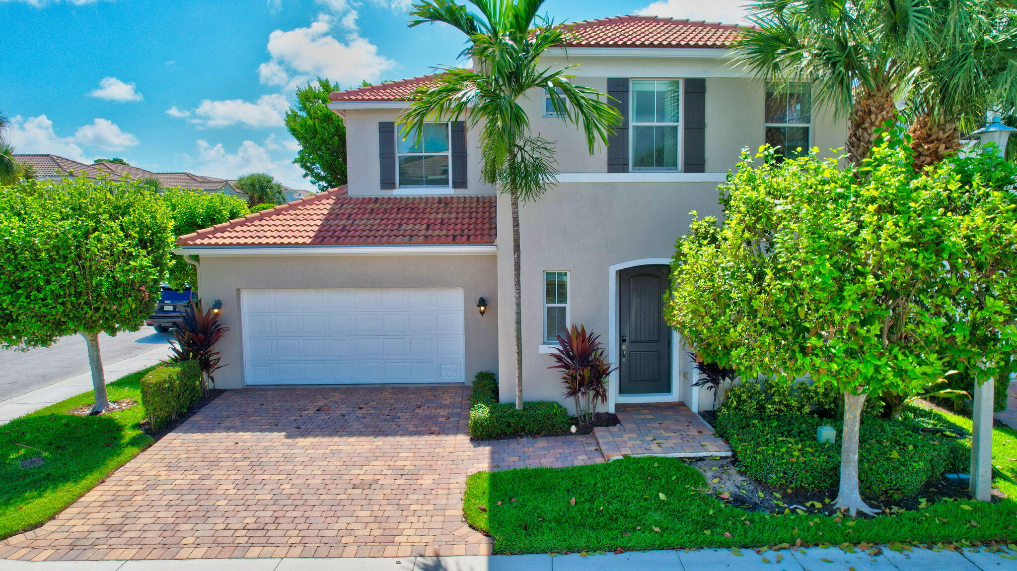 3630 Wolf Run Lane Boynton Beach, FL 33435 - Photo 46 of 59 a front view of house with yard and green space