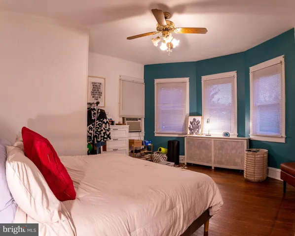 a bed room with a bed and a chandelier