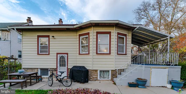 a view of house with outdoor space and seating area