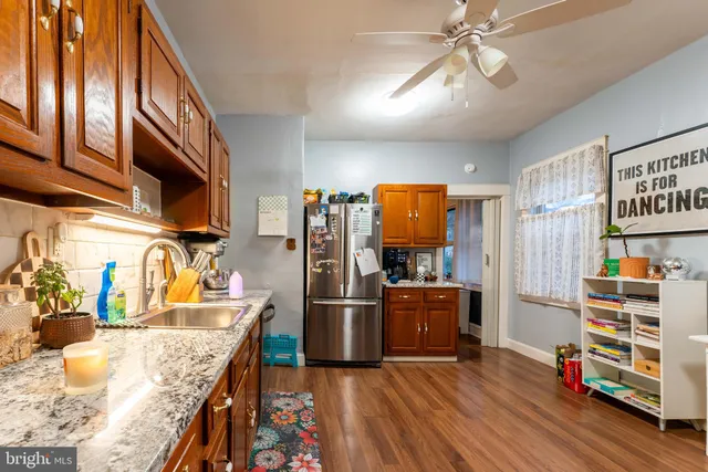 a kitchen view of counter top space and wooden floor