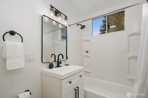 a bathroom with a sink and mirror