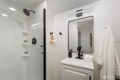 a bathroom with a toilet sink and shower