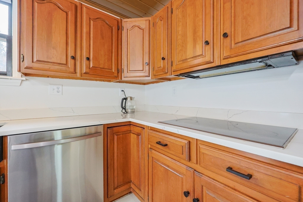 6 Matthew Lane Chelmsford, MA 01824 - Photo 12 of 37 a kitchen with stainless steel appliances granite countertop white cabinets and a white wooden cabinets