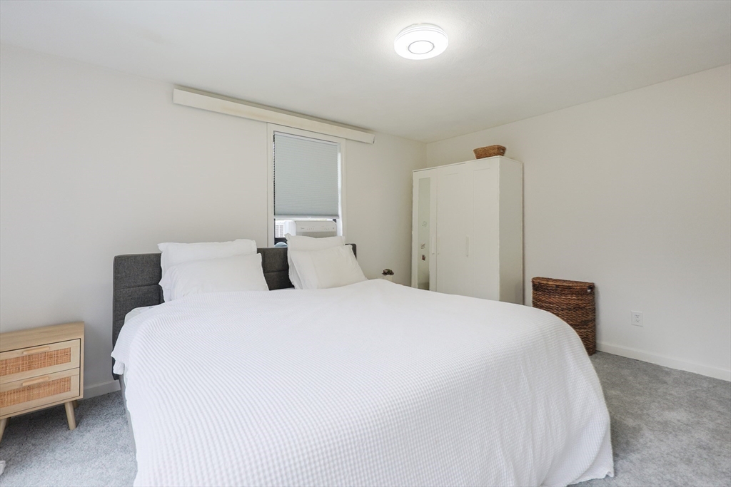 6 Matthew Lane Chelmsford, MA 01824 - Photo 17 of 37 a bedroom with a bed and a chair