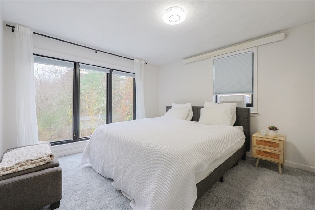 6 Matthew Lane Chelmsford, MA 01824 - Photo 18 of 37 a bedroom with a bed and a window