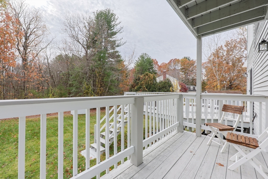 6 Matthew Lane Chelmsford, MA 01824 - Photo 29 of 37 a view of balcony with wooden floor and fence
