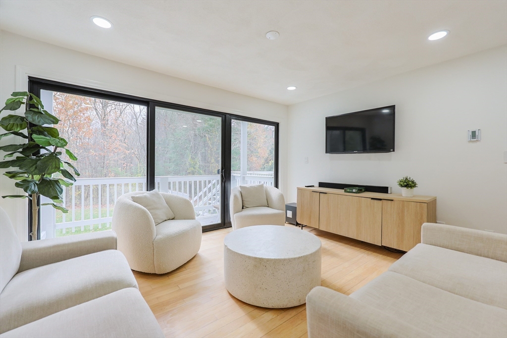 6 Matthew Lane Chelmsford, MA 01824 - Photo 5 of 37 a living room with furniture and a flat screen tv