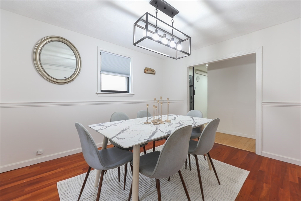 6 Matthew Lane Chelmsford, MA 01824 - Photo 6 of 37 a view of a dining room with furniture and wooden floor