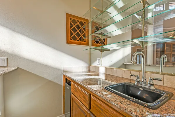 a kitchen that has a sink and a stove