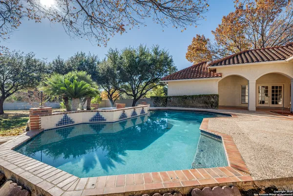 a view of swimming pool with a patio
