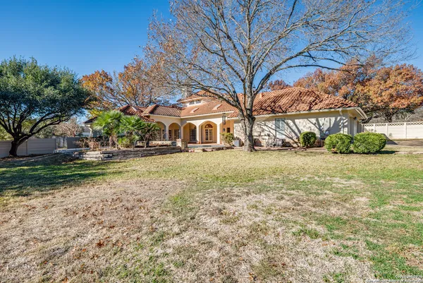 a front view of house with yard and green space