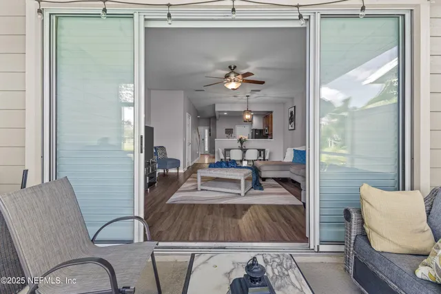a view of living room and kitchen with furniture