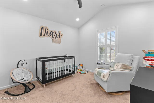 a bedroom with furniture and a window