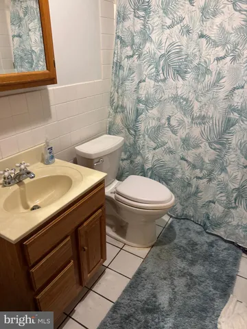 a bathroom with a sink toilet and vanity