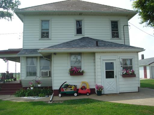 675 North 16th Road Lostant, IL 61334 - Photo 1 of 1 a front view of a house with a garden and plants