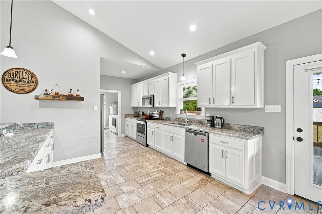 8718 Rock Cedar Road New Kent, VA 23124 - Photo 15 of 43 Kitchen featuring white cabinetry, stainless steel