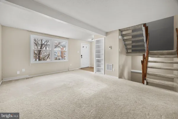 a view of an empty room with a window