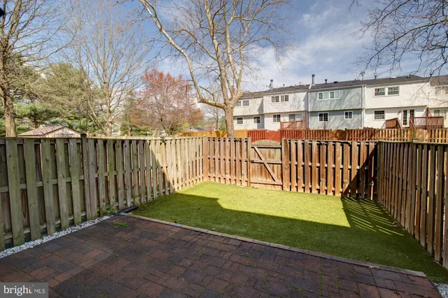 a view of a wooden deck with a yard