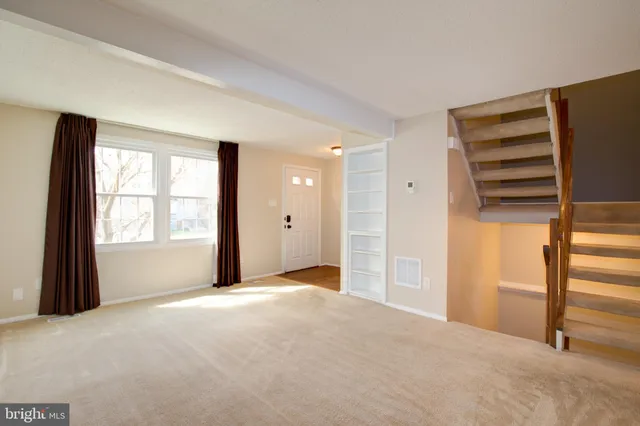 a view of a room with a large window