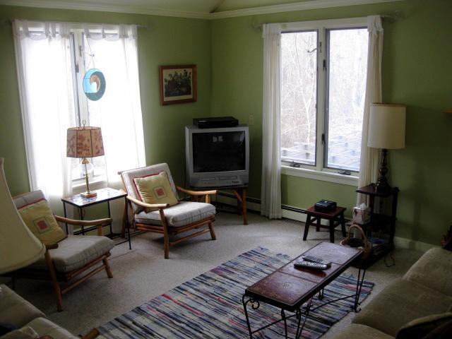380 Governor Prence Road Eastham, MA 02642 - Photo 13 of 28 a living room with furniture and a flat screen tv