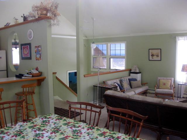 380 Governor Prence Road Eastham, MA 02642 - Photo 15 of 28 a bedroom with a bed and a table in it