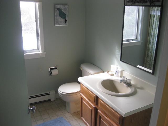 380 Governor Prence Road Eastham, MA 02642 - Photo 19 of 28 a bathroom with a sink toilet and a mirror
